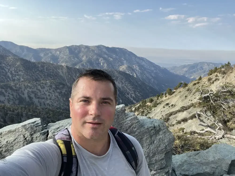 Me getting a selfie with the mountainous background