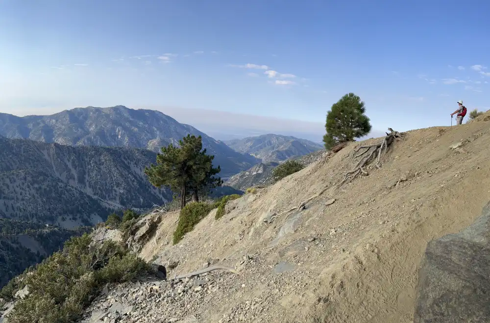 hiker looking at scenic mountains